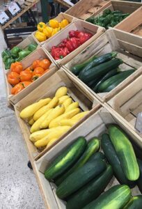 farm produce with zucchini squash and bell peppers